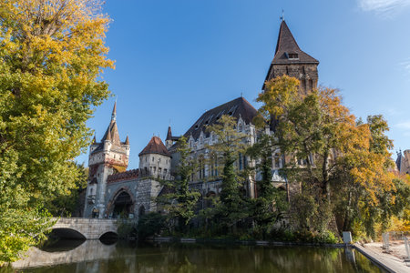 Vajdahunyad Castle of early 20th century in Budapest, view from the side of corner tower and entrance gate with Gate Tower at autumn sunny dayの写真素材