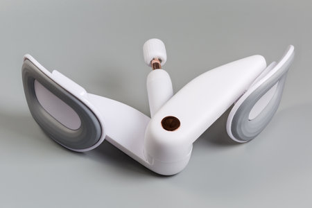 Multifunctional spring exerciser with adjustable resistance for training of inner thigh, pelvic floor muscle and buttocks on a gray backgroundの写真素材