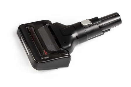 Replaceable mini attachment of a domestic vacuum cleaner with rotatable turbo brush for dry cleaning and cleaning pet fur and hair on a white backgroundの写真素材