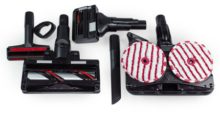 Replaceable attachments with rotatable brushes and mops, upholstery and crevice nozzles of a domestic vacuum cleaner for dry and wet cleaning, view from the bottom side on a white backgroundの写真素材