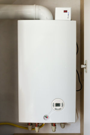 Household wall-mounted system gas boiler installed in the special niche indoorsの写真素材