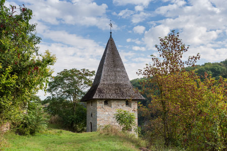 Stone tower of the 16th century on the canyon edge, as part of the eastern part of the medieval Old city fortifications in Kamianets-Podilskyi in autumn sunny day, Ukraineの写真素材