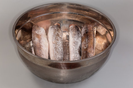 Uncooked frozen carcasses of Argentine hake, or hake hubbsi without the heads and tails in the big...