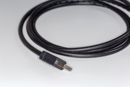 Full-size connector on the edge of appropriate cable for connect computer to monitor on a gray...