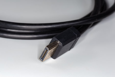Full-size connector on the edge of appropriate cable for connect computer to monitor on a gray...