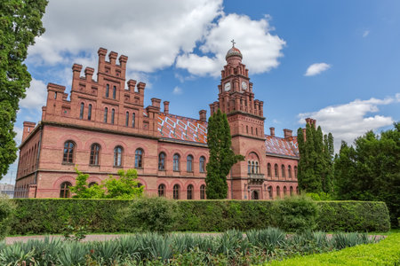 East building with clock tower of Chernivtsi National University complex, former Monastery building of residence of the Metropolitans  in spring sunny day, Ukraine,の写真素材