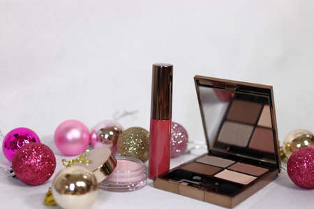 Colorful decoration with lipstick cosmetics with eyeshadow and highlights (white background)の写真素材