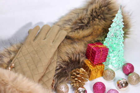 Christmas glittering decoration with fur stall and gloves (white background)の写真素材