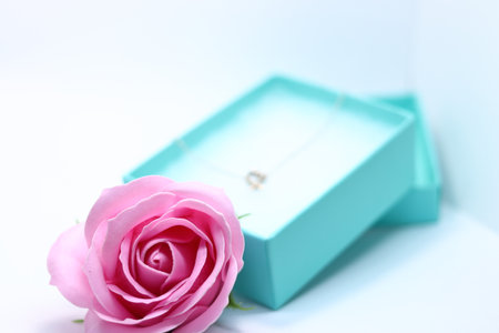 Heart necklace and pink rose in gift boxの写真素材