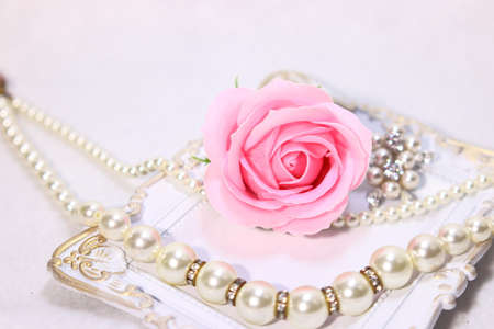Rose and pearl accessories (necklace and brooch)の写真素材