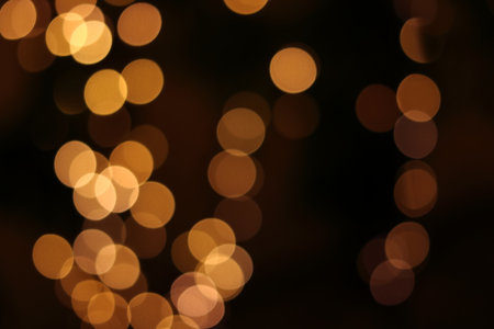 Illumination of the city at night Golden bokeh background textureの写真素材