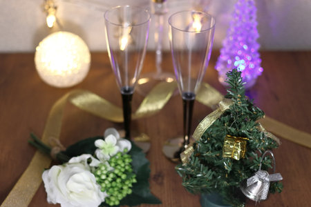 Christmas tree, candles and champagne glassesの写真素材