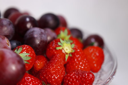 Lots of strawberries and grapesの写真素材