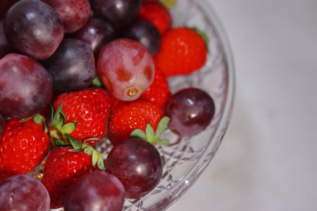 Assorted lots of strawberries and grapesの写真素材
