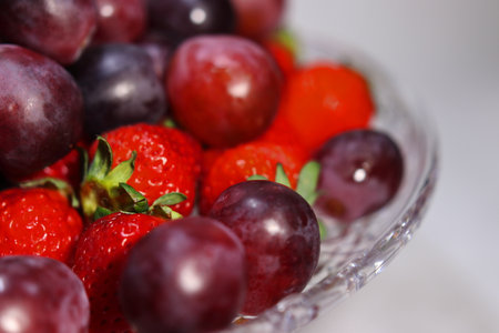 Assorted lots of strawberries and grapesの写真素材