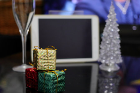 Prepare for online party (Christmas tree and Christmas decorations with tablet PC and champagne glass)の写真素材