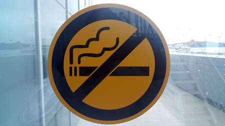 No Smoking Sign on Wet Window. Raining Day