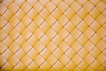 Woven yellow leather texture background. Close upの写真素材