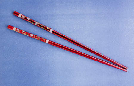 Japanese chopsticks, flower pattern on blue backgroundの写真素材