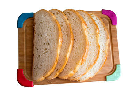 Sliced white bread on a wooden board isolated on white background