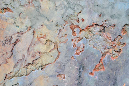building wall with crumbling plaster places