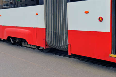 Fragment of lower part of tram in place where sections of car are connected closeup. Image can be used as backgroundの写真素材