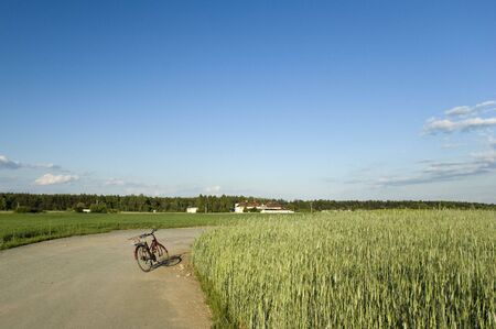 Bicycle tour through the fields to the villageの写真素材