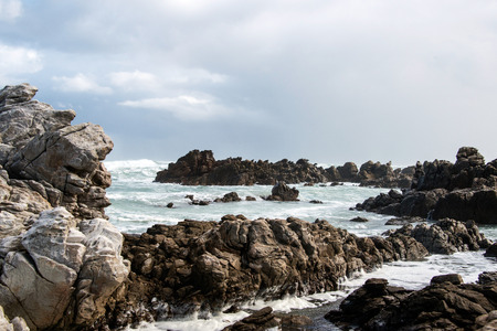 Waves breaking on rocks at Cape Agulhasの写真素材