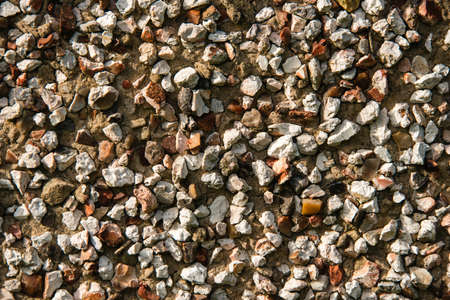 Pebble dash wall on the side of a house