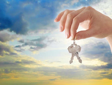 A photo of hand holding keysの写真素材