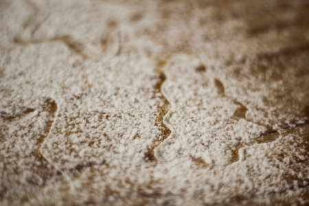 Ingredients for cooking Christmas baking: fir tree made from flour on a light table, kitchen utensils, top view.の写真素材