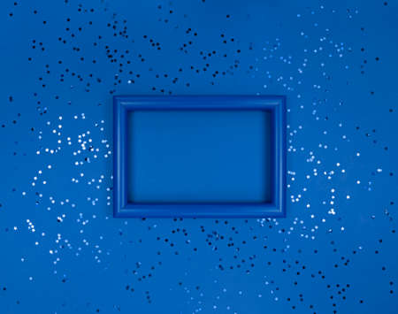 Frame and confetti stars on navy background.の写真素材