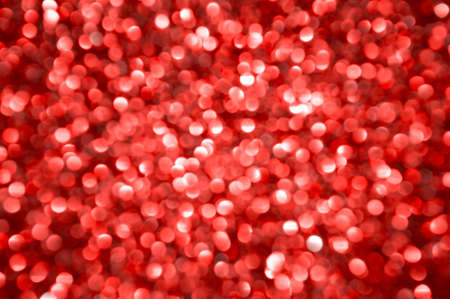 Red defocused lights background. Abstract festive backdrop.