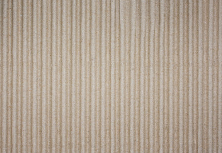 Corrugated Cardboard Texture. Vertical Ribbed Paper Surface Close Up. Stock photo.の写真素材