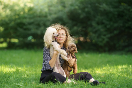 Woman with Two Poodles