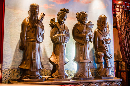 four figures in Chinese restaurant interiorのeditorial素材