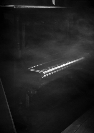 Piano in smoke on the dark backgroundの写真素材