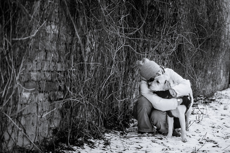 girl is hugging labrador retrieverの写真素材