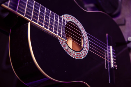 black wooden body of the guitarの写真素材