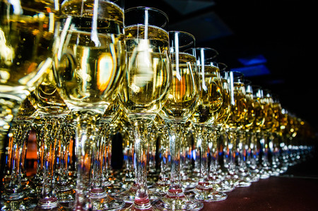 row of champagne glasses close upの写真素材