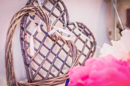 Two hearts made of rattan. Wedding decoration with braided accessoriesの写真素材