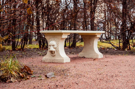 St. Petersburg, Russia - November 12, 2014: a stone bench with the lion bas relief in the park of Oranienbaumのeditorial素材