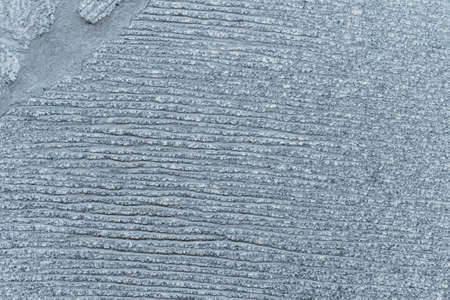 a floor made of the granite slabs with furrows and concreteの写真素材