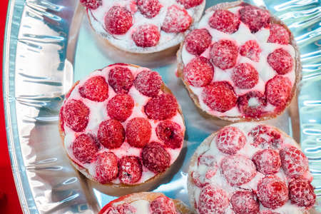 delicious pastries with raspberries at a tasting partyの写真素材