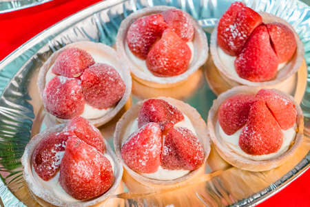 delicious pastries with strawberries at a tasting partyの写真素材