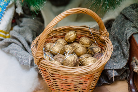 Christmas decoration in the form of a basket with gilded nutsの写真素材