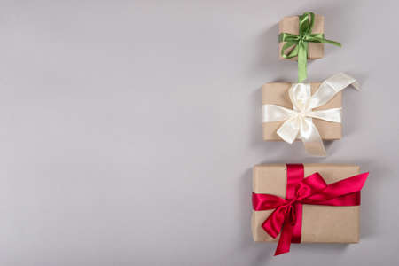Beautiful packaging of presents with satin ribbons and craft paper.の写真素材