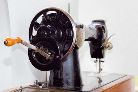 old antique sewing machine close-up in parts in the photo