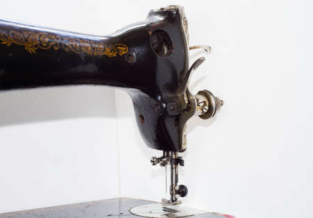 old antique sewing machine close-up in parts in the photo