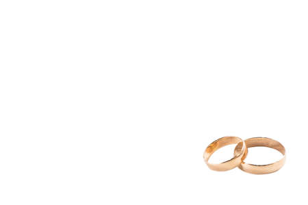Two gold wedding rings isolated symbolize love, weddingの写真素材